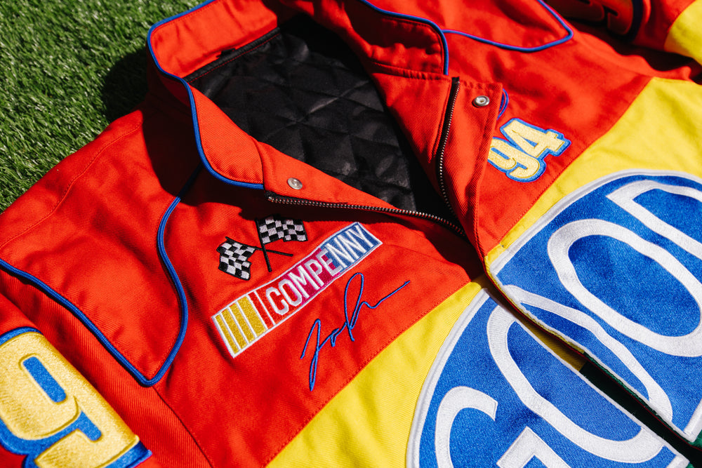 Good Compenny jacket with red and yellow panels, contrasting trim, and branded detailing